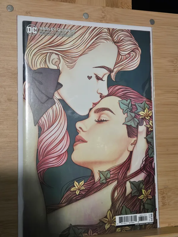 Harley Quinn #31 variant cover by artist Jenny Frison, featuring a tender moment between Harley Quinn and Poison Ivy.