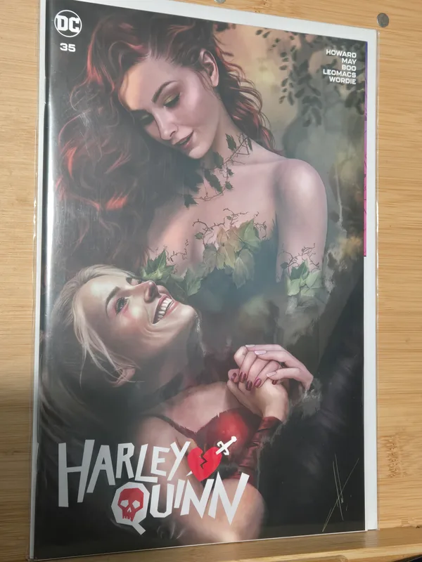 Harley Quinn #35 comic book featuring a beautifully illustrated cover of Poison Ivy and Harley Quinn.